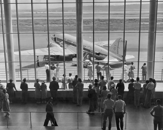 An Eastern Air Lines DC-3, which was known as "The Great Silver Fleet" during its heyday, is seen through an airport viewing gallery in 1945. 