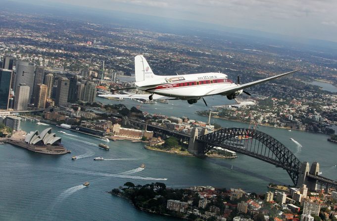 A DC-3 carrying ex-service men and women flies over Sydney Harbor on Australia New Zealand Army Corps Day to commemorate the anniversary of the World War I invasion of Gallipoli.