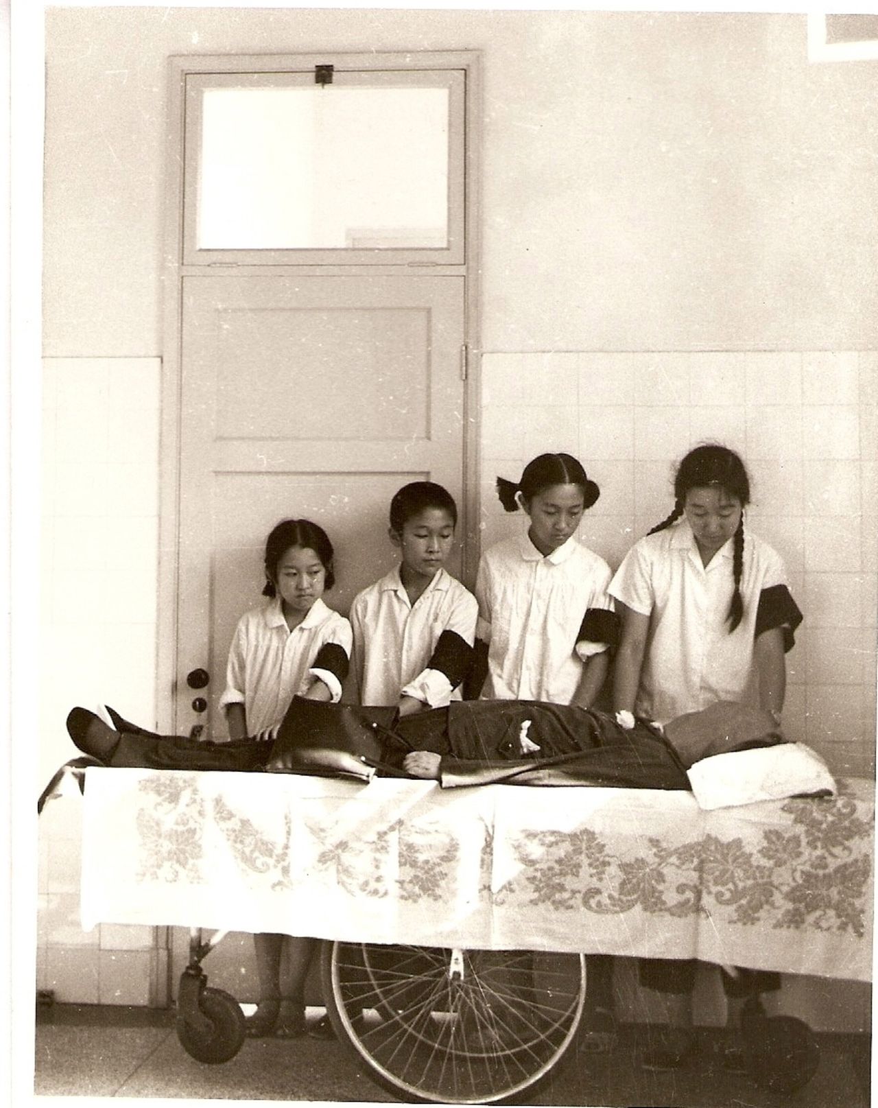 Bian Zhongyun's four children stand over her body after she was beaten to death on August 5th, 1966. Her husband Wang Jingyao took the photograph. "I covered Bian's face so my youngest couldn't see," he says.