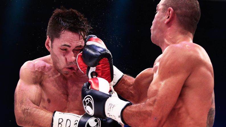 Sam Soliman punches Felix Sturm during their IBF middleweight title fight Saturday, May 31, in Krefeld, Germany. Soliman won by unanimous decision.