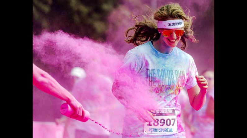 A runner is hit with colored powder during the Color Run in Amsterdam, Netherlands, on Saturday, May 31. The race, billed as "the happiest 5K on the planet," is held in different cities worldwide throughout the year.