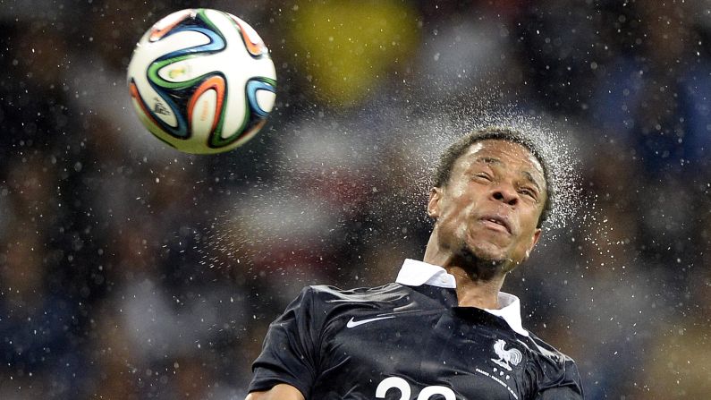 French forward Loic Remy jumps for a header Sunday, June 1, during an international friendly match against Paraguay in Nice, France. The World Cup warm-up for France ended in a 1-1 draw.