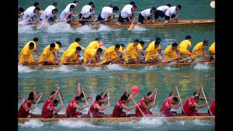 Teams race their dragon boats on a river in Tongren, China, on Sunday, June 1. Dragon boat races were held across China to celebrate the annual Dragon Boat Festival, which traditionally falls on the fifth day of the fifth lunar month.
