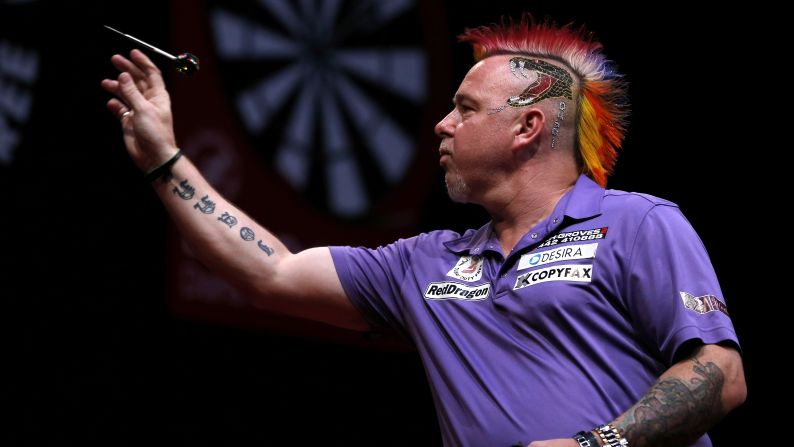 Peter Wright, a professional darts player from England known for his <a href="index.php?page=&url=http%3A%2F%2Fwww.dailymail.co.uk%2Fsport%2Fothersports%2Farticle-2531863%2FPETER-WRIGHT-interview-Wife-Jo-does-hair-takes-two-hours-day.html" target="_blank" target="_blank">always-changing hair color</a>, competes Friday, May 30, in the semifinals of the Dubai Duty Free Darts Masters. The event, held in Dubai, United Arab Emirates, was the first World Series of Darts event this year. Wright advanced to the final but lost to Michael van Gerwen.