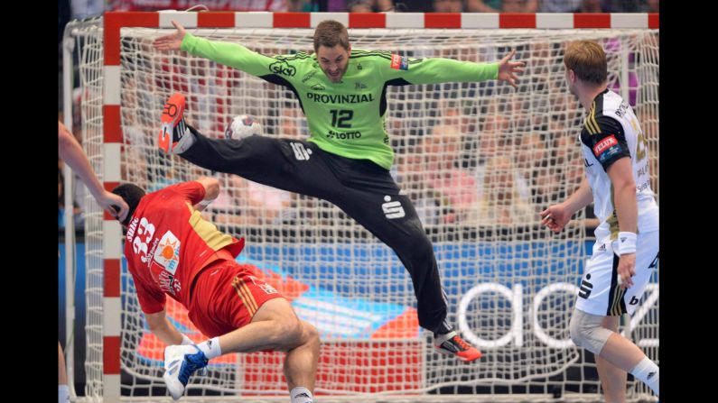 Renato Sulic of Hungarian club MKB Veszprem throws the ball past Andreas Palicka of German club THW Kiel during the semifinals of the EHF Champions League, Europe's premier handball competition, on Saturday, May 31. Kiel won the match 29-26 but lost to fellow German club Flensburg in the final one day later.