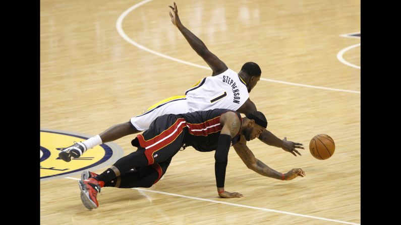 Indiana's Lance Stephenson and Miami's LeBron James dive for a loose ball Wednesday, May 28, during Game 5 of the NBA's Eastern Conference finals. Indiana won the game but lost the series to Miami, which is looking to win its third straight NBA title.
