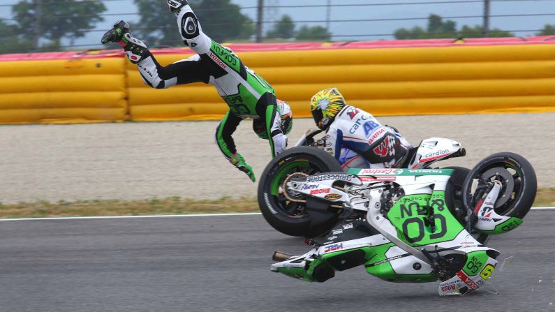MotoGP rider Alvaro Bautista flies through the air as he falls from his bike during a practice at the Italian Grand Prix on Friday, May 30. He was not seriously injured.