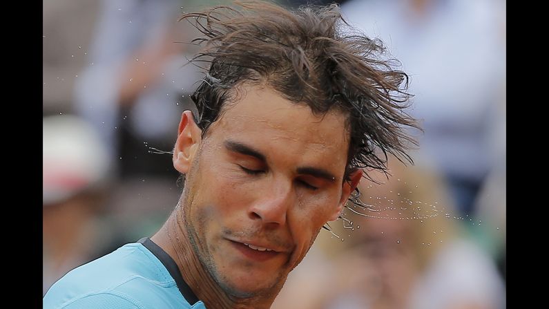 Rafael Nadal shakes the sweat off his head after beating Dusan Lajovic on Monday, June 2, in the fourth round of the French Open. Nadal, the top-ranked tennis player in the world, has won eight of the last nine French Opens.