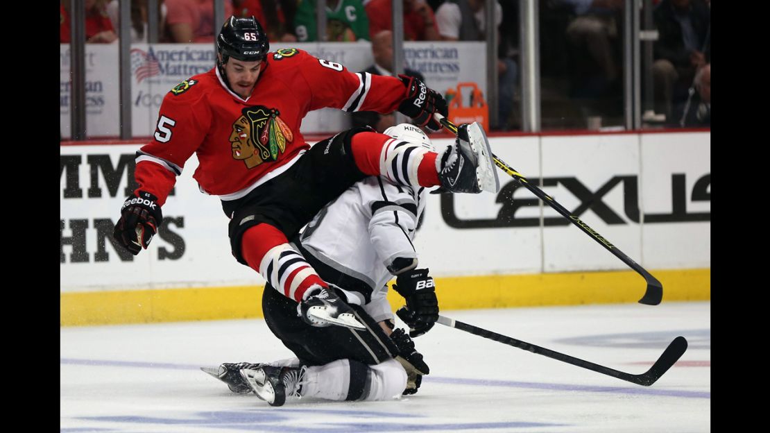 Andrew Shaw of the Chicago Blackhawks collides with Kyle Clifford of the Los Angeles Kings during the Western Conference Final in the 2014 Stanley Cup Playoffs at United Center on June 1, 2014 in Chicago, Illinois.