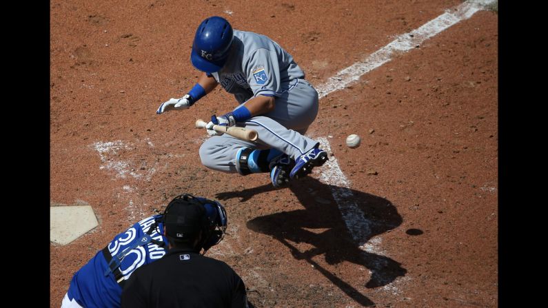 With the bases loaded, Kansas City's Norichika Aoki, right, is hit by a pitch in a game against the Toronto Blue Jays on Saturday, May 31. The Royals won the game 6-1 but split a four-game series with the Blue Jays in Toronto.