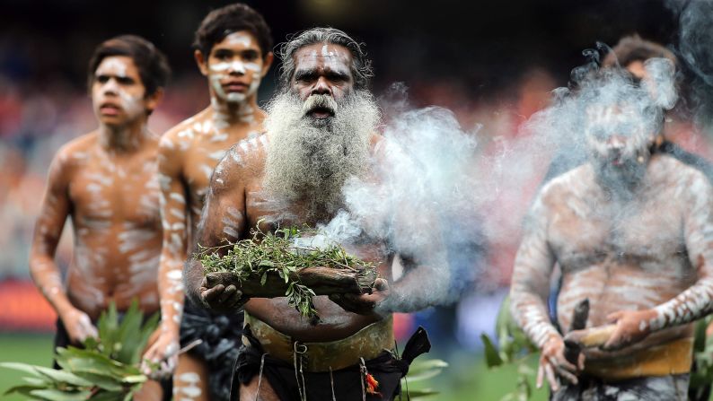 An elder performs the traditional Welcome to Country ceremony during the Australian Football League match between the Adelaide Crows and the Gold Coast Suns on Sunday, June 1.