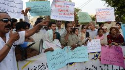 Pakistani activists from the PPP Social Media hold placards as they chant slogans during a protest against the killing of pregnant woman Farzana Parveen was beaten to death with bricks by members of her own family for marrying a man of her own choice in Lahore on May 30, 2014. Pakistani police investigating the murder of a woman bludgeoned to death outside a court have arrested four men, a senior officer said, as her husband said he wanted her killers to "die in pain". AFP PHOTO/Arif ALIArif Ali/AFP/Getty Images
