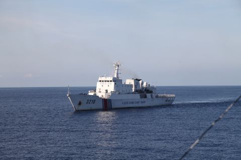 A Chinese Coast Guard vessel closely follows CG 8003.
