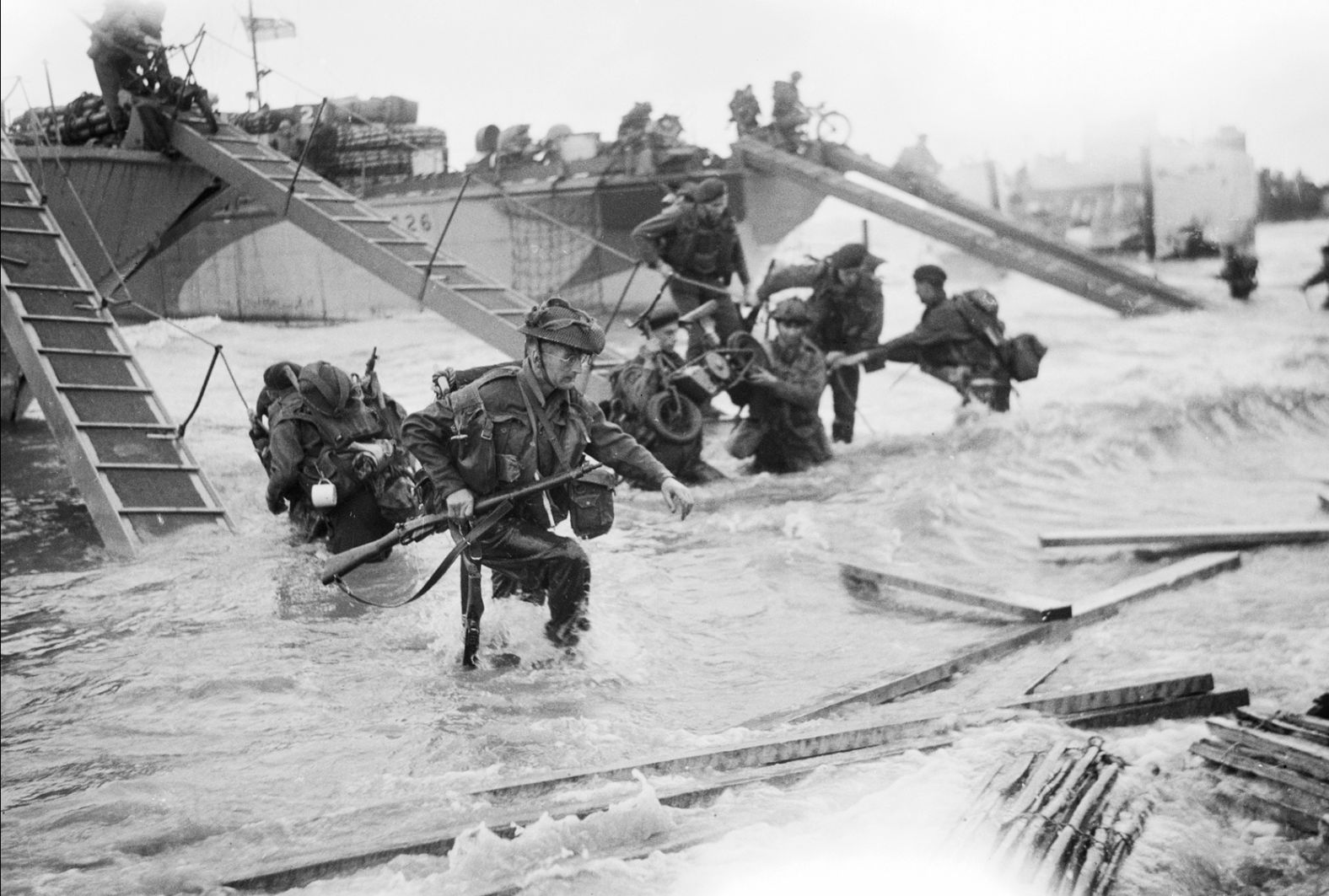 Commandos with the British Royal Navy advance on the beach. Planning for D-Day began more than a year in advance, and the Allies carried out substantial military deception to confuse the Germans as to when and where the invasion would take place.