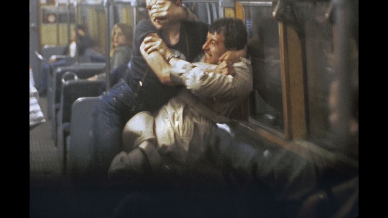 Mazzer recalls this fight, which he photographed around 1981, as starting after the man in braces obstructed the underground doors. The other man politely asked him to let the doors shut, but, as Mazzer's book details: "'Braces' harangued him with finger in face, very aggressive," not realizing the other man "was a black belt and about to rip him apart."'