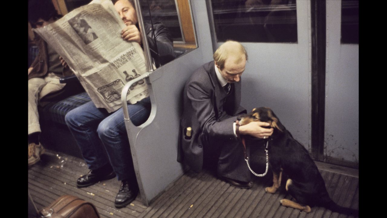 Here, a man takes comfort from his dog. "I remember being so touched by the whole scene," Mazzer says, noting the rarity of a adult sitting on the floor. It seemed "so sweet...a man's best friend in his hour of need."