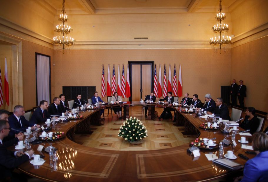Obama, at right, is seated with a U.S. delegation as he participates in a bilateral meeting with Polish Prime Minister Donald Tusk and the Polish delegation in Warsaw on June 3. While in Poland, Obama announced he would ask Congress for $1 billion to be put toward bolstering NATO's security alliance in Europe.