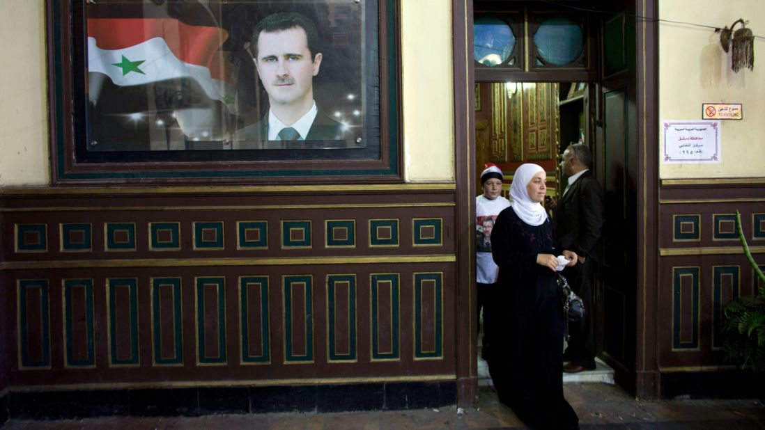 A woman leaves a polling station at an old train station in Damascus on June 3.