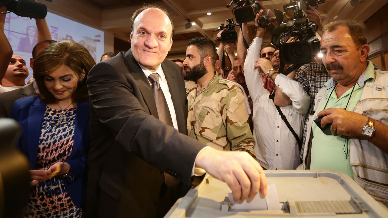 Presidential candidate Hassan al-Nouri casts his ballot in Damascus on June 3. Al-Nouri is a businessman and former government minister.