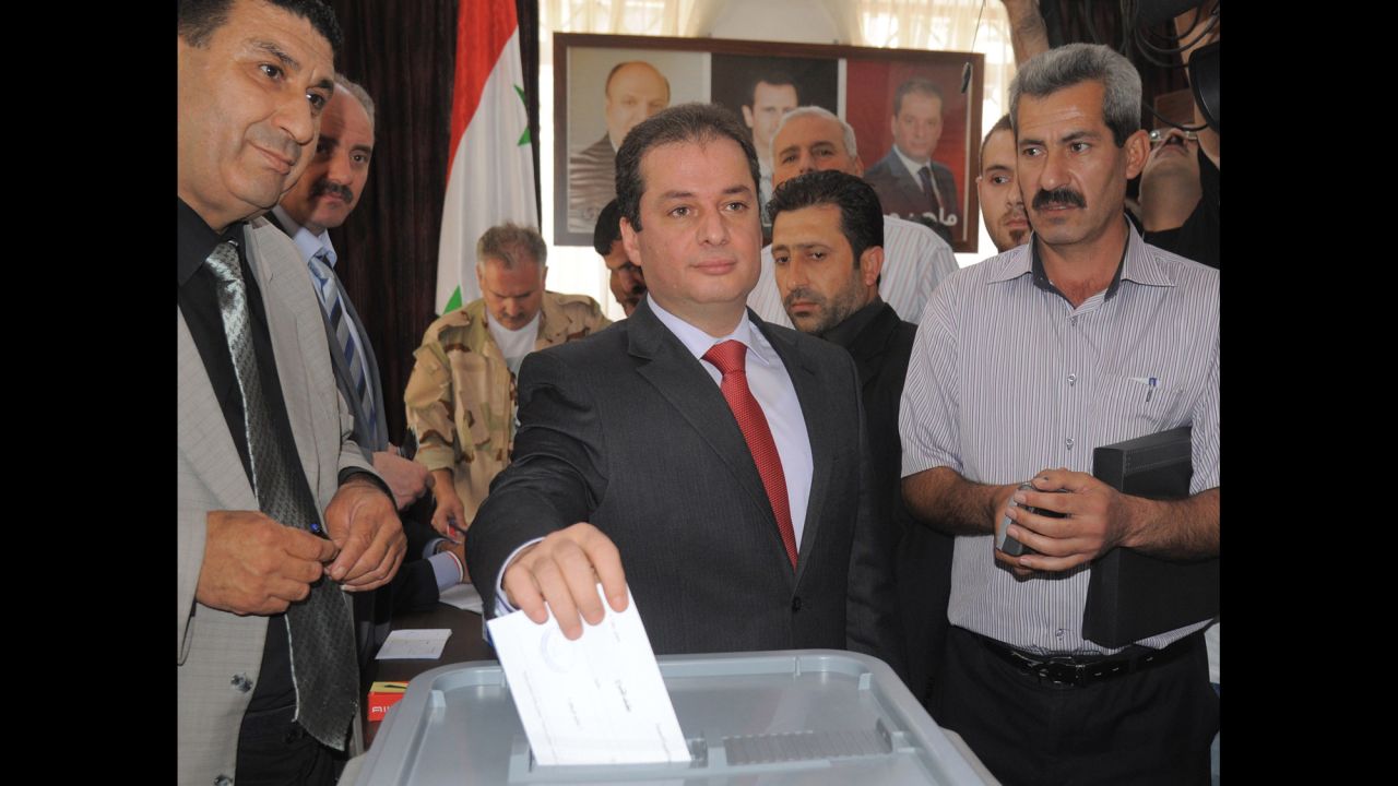 In this handout photo released by SANA, presidential candidate Maher Hajjar casts his vote in Damascus on June 3. Hajjar is a lawmaker.