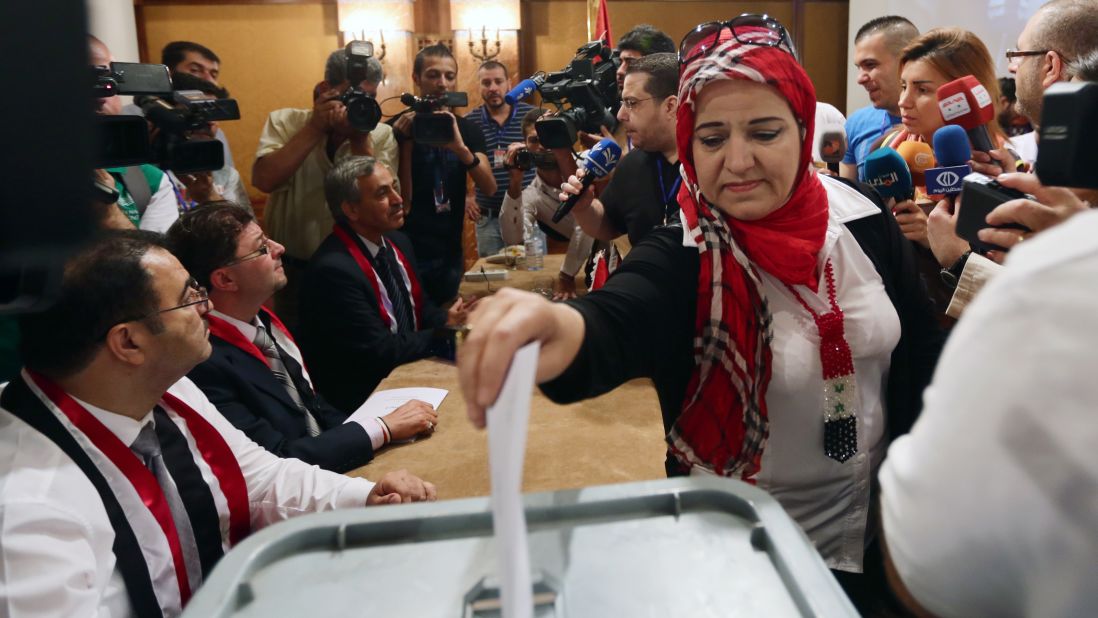 A woman casts her ballot June 3 in Damascus.