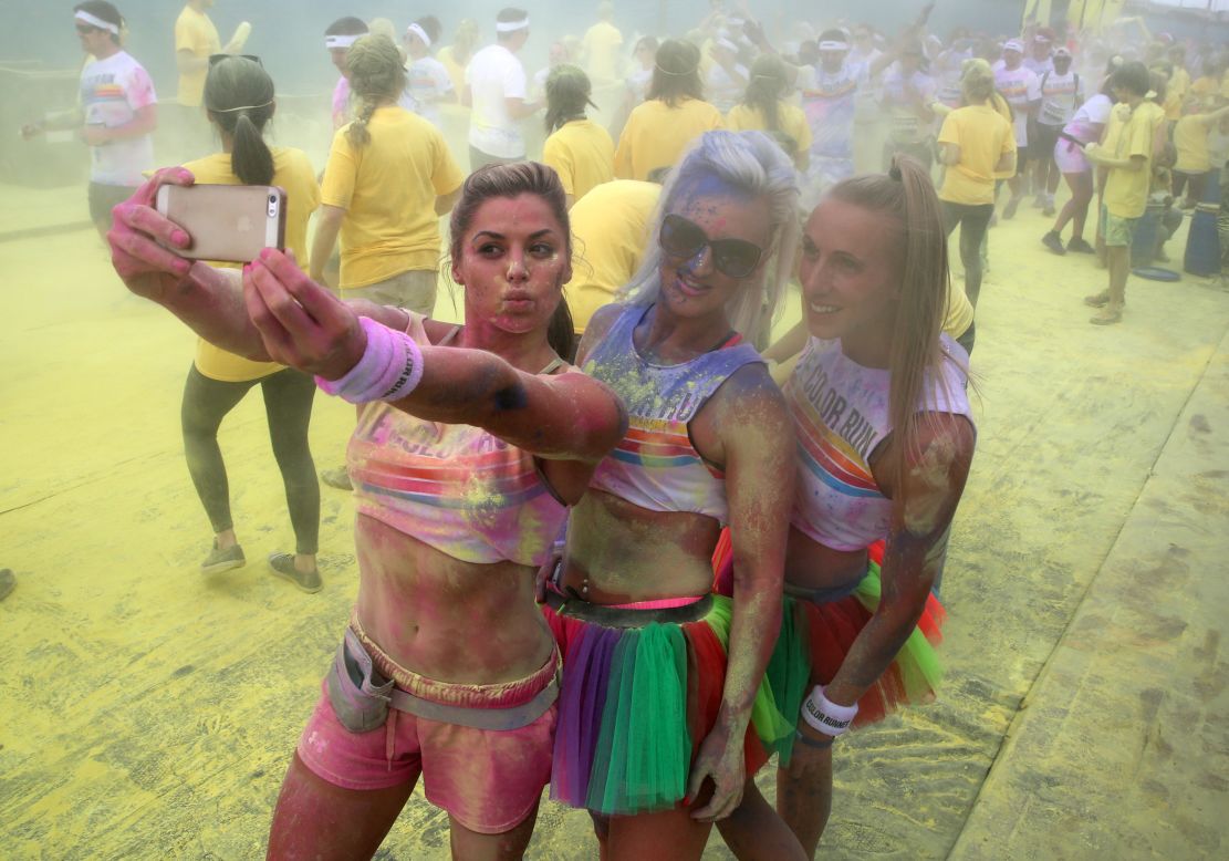People pose for a selfie as they take part in the Color Run in London on Sunday, June 1. The race, billed as "the happiest 5K on the planet," involves lots of colored powder and takes place in different cities worldwide throughout the year.