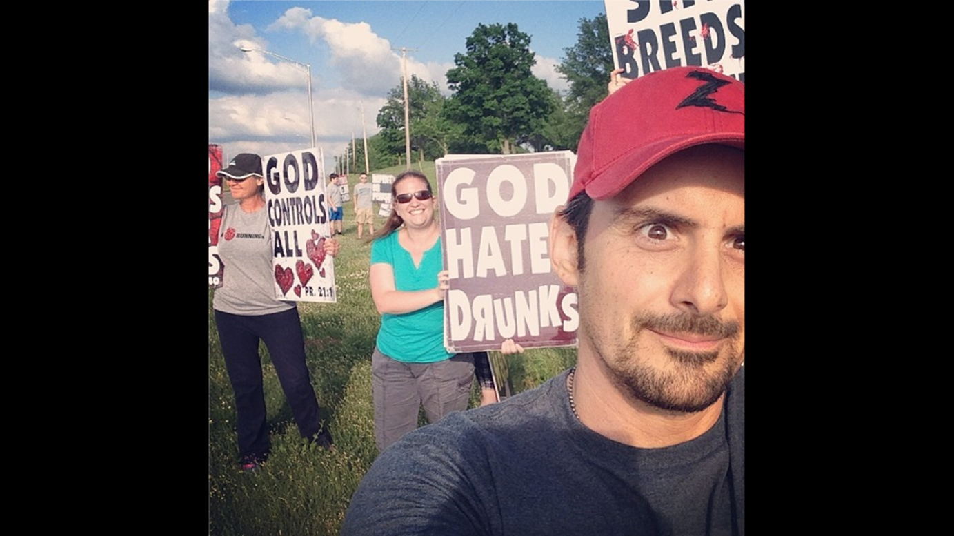 Protesters from Westboro Baptist Church are seen behind country music star Brad Paisley in this selfie <a href="http://instagram.com/p/ouJUqsN5QO/" target="_blank" target="_blank">he posted</a> before his concert Sunday, June 1, in Bonner Springs, Kansas. The Kansas church is known for its virulently anti-gay protests. "Westboro Baptist Selfie!!" Paisley wrote. "Or west-Burro(ass) selfie. Hopefully they can hear the show out here. We'll play loud."