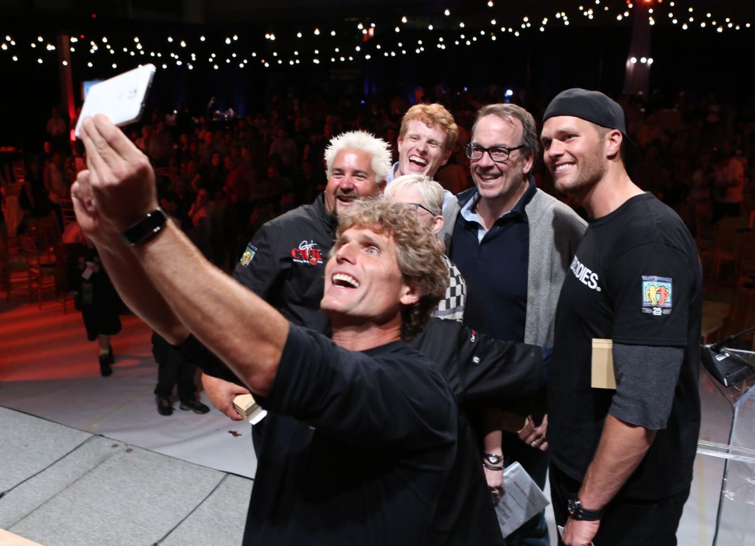 Anthony Shriver, founder and chairman of the nonprofit Best Buddies International, takes a selfie with some famous faces Friday, May 30, during a dinner party in Boston. The four men behind Shriver, from left, are renowned chef and television host Guy Fieri, Congressman Joe Kennedy of Massachusetts, financial services executive John Hailer and New England Patriots quarterback Tom Brady. Best Buddies advocates for people with intellectual and developmental disabilities.