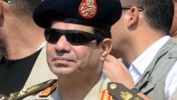 Egyptian Defense Minister and Military Chief General Abdel Fattah al-Sisi attends the funeral of Giza security chief Nabil Farrag in the district of Giza, on the outskirts of Cairo, on September 20, 2013