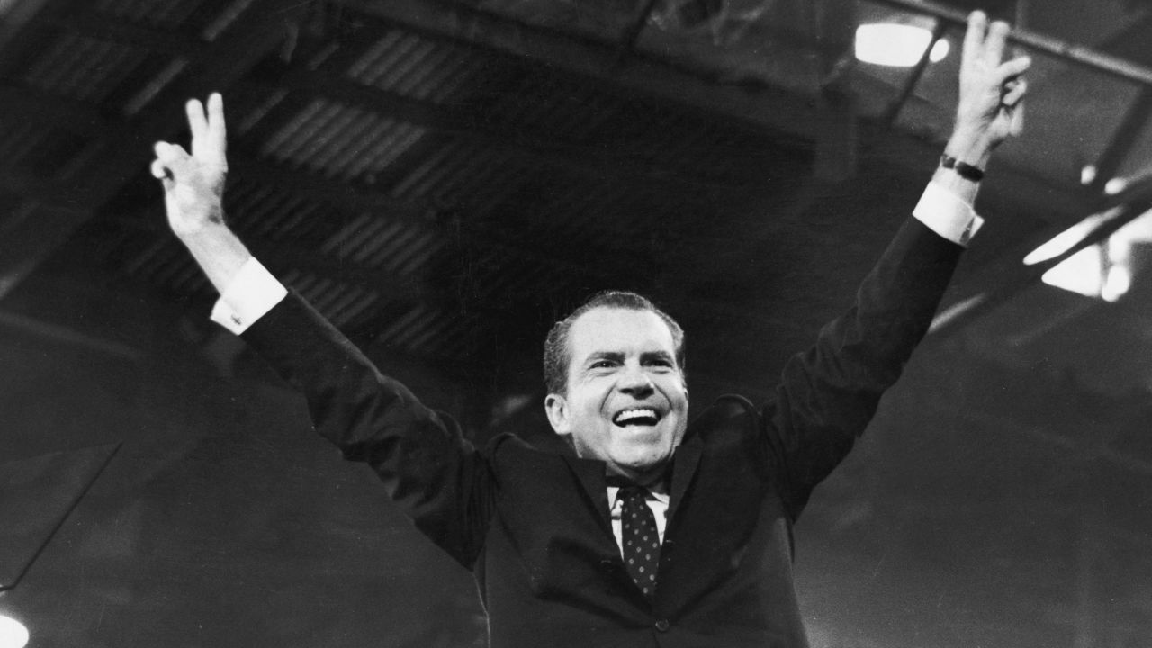 Nixon gives the victory sign after winning the presidential nomination at the GOP Convention in August, 1968.