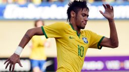 Brazilian forward Neymar celebrates after scoring against Panama during a friendly match as preparation for FIFA World Cup Brazil 2014, at Serra Dourada Stadium in Goiania, Goias State, on June 3, 2014. The FIFA World Cup Brazil 2014 is set to begin in just a few days, with Brazil and Croatia competing in the opening match on June 12 at Maracana Stadium in Rio de Janeiro.  AFP PHOTO/Evaristo SA        (Photo credit should read )