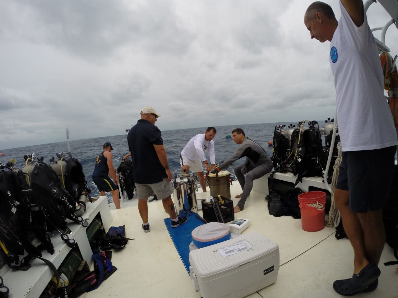 On the surface, FIU teams prepare pots with dry clothes, camera equipment and other gear to be sent down to Aquarius.