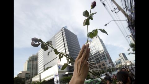 A protester adopts the three-fingered salute from "The Hunger Games" during an anti-coup demonstration in front of the Australian Embassy in Bangkok on June 4. 