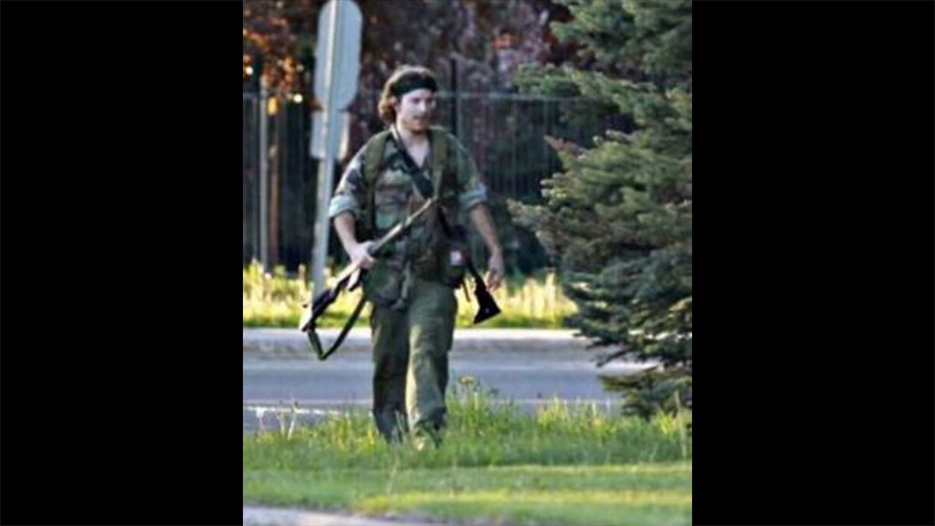 Police posted to social media a photograph of a man dressed in fatigues, carrying what appeared to be a rifle.