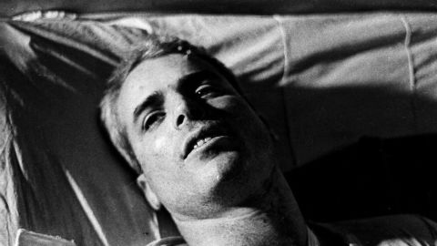 This file picture taken in 1967 shows US Navy Lt. Cmdr. John McCain lying on a bed in a Hanoi hospital as he was being given medical care for his injuries. 