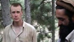 This file image provided by IntelCenter on Wednesday Dec. 8, 2010 shows a frame grab from a video released by the Taliban containing footage of a man believed to be Sgt. Bowe Bergdahl, left.