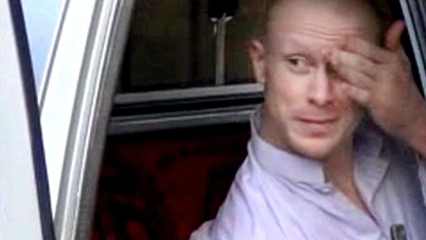In this image taken from video obtained from Voice Of Jihad Website, which has been authenticated based on its contents and other AP reporting, Sgt. Bowe Bergdahl, sits in a vehicle guarded by the Taliban in eastern Afghanistan. The Taliban on Wednesday, June 4, 2014 released a video showing the handover of Bergdahl to U.S. forces in eastern Afghanistan, touting the swap of the American soldier for five Taliban detainees from Guantanamo as a significant achievement for the insurgents. (AP Photo/Voice Of Jihad Website via AP video)