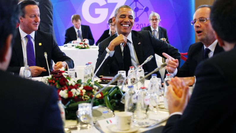 President Obama laughs with British Prime Minister David Cameron, left, and Hollande during a G7 session in Brussels, Belgium, on Thursday, June 5.