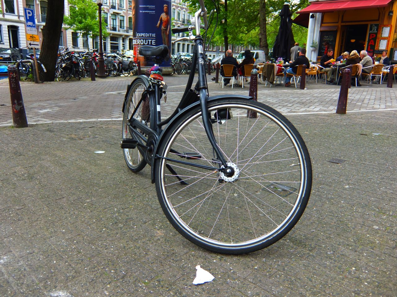 Many big companies rent out bikes in lurid colors. The key to blending in is renting a typical Dutch-style cycle, like this black, indestructible machine. 