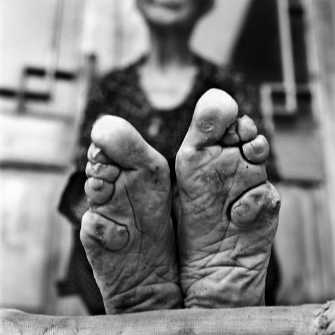 Jo Farrell is a Hong Kong-based photographer who focuses on female traditions that are dying out. In the past eight years, she has photographed 50 women with bound feet in rural China. Most live in an area two hours outside of Jinan, Shandong province. Here we see Zhao Hua Hong's feet. 