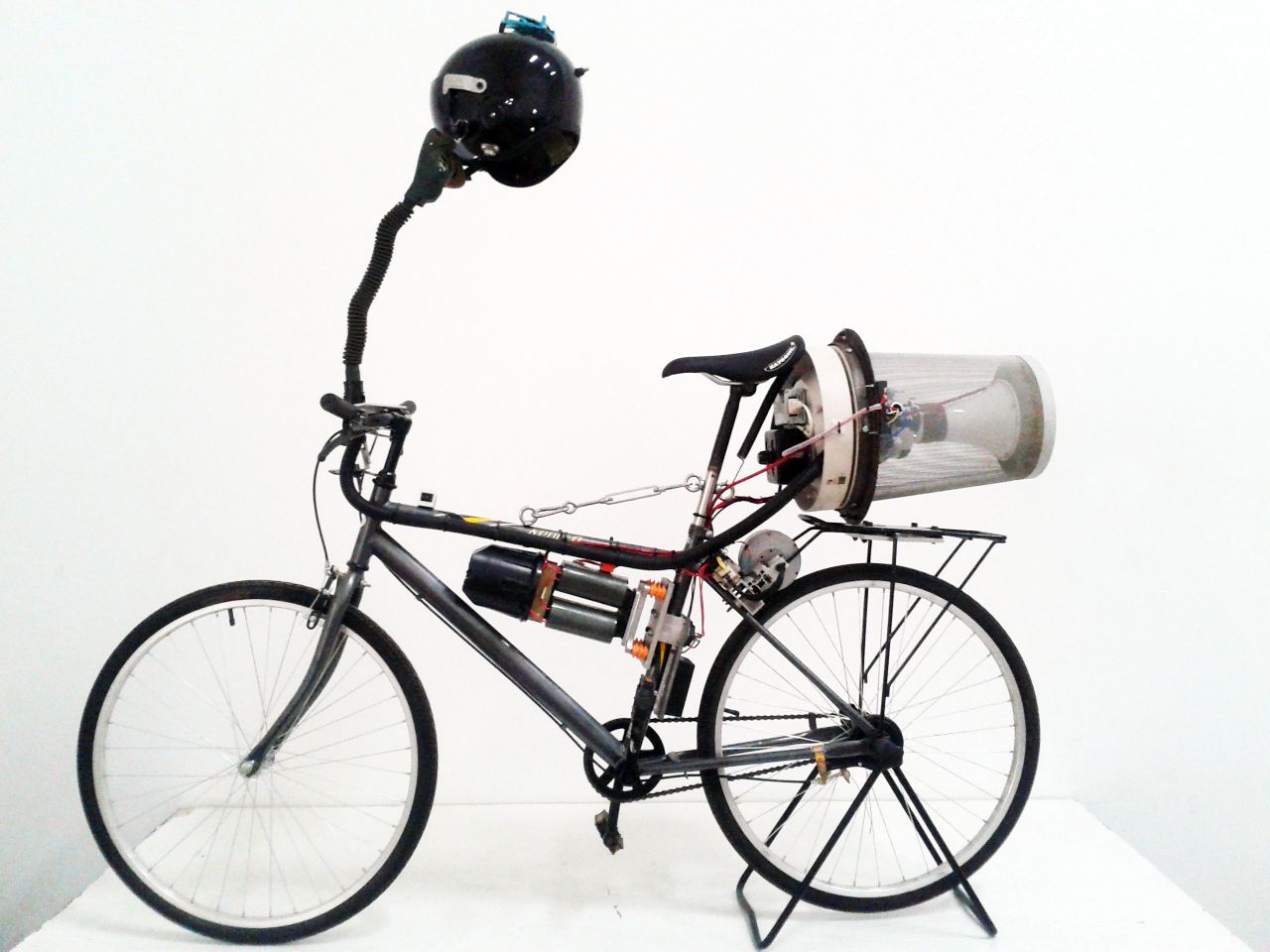 British artist Matt Hope attached a small generator to a bike's back wheel and as he pedals, electricity is produced to power his homemade filtration system. He says it's "an ironic commentary about living in China."