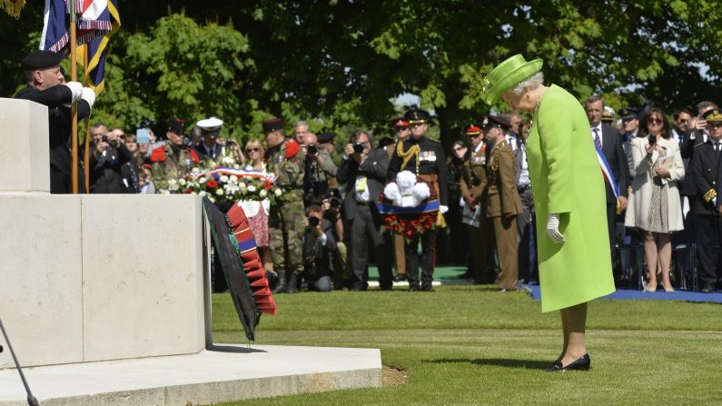 Queen Elizabeth pays her respects after laying a wreath during a ceremony at the British War Cemetery in Bayeux, France.