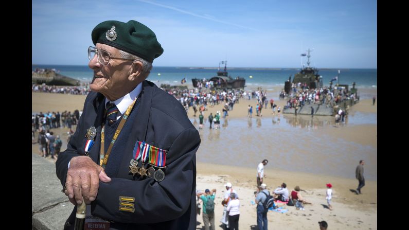 British veteran John Trevor sits by the beach in Arromanches-les-Bains on June 6.