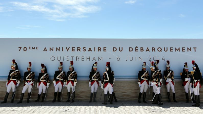 French Republican Guards stay in the shade before a ceremony in Ouistreham.