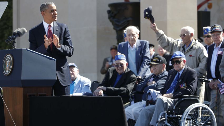 U.S. President Barack Obama acknowledges veterans as he speaks at Normandy American Cemetery at Omaha Beach as he participates in the 70th anniversary of D-Day in Colleville sur Mer in Normandy, France, Friday, June 6, 2014.
