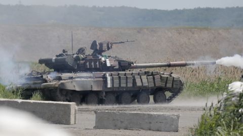 A Ukrainian tank opens fire during a battle with pro-Russian separatist fighters in Slovyansk on Friday, June 6.