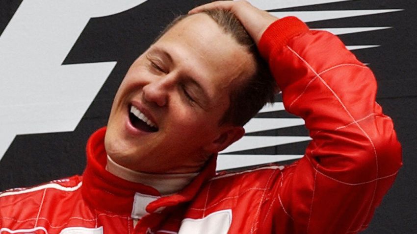 German Ferrari F1 driver Michael Schumacher celebrates on the podium after winning the 2004 Grand Prix of Canada, 13 June, 2004, at the Circuit Gilles Villeneuve in Montreal, Quebec. AFP PHOTO/Stan HONDA (Photo credit should read STAN HONDA/AFP/Getty Images