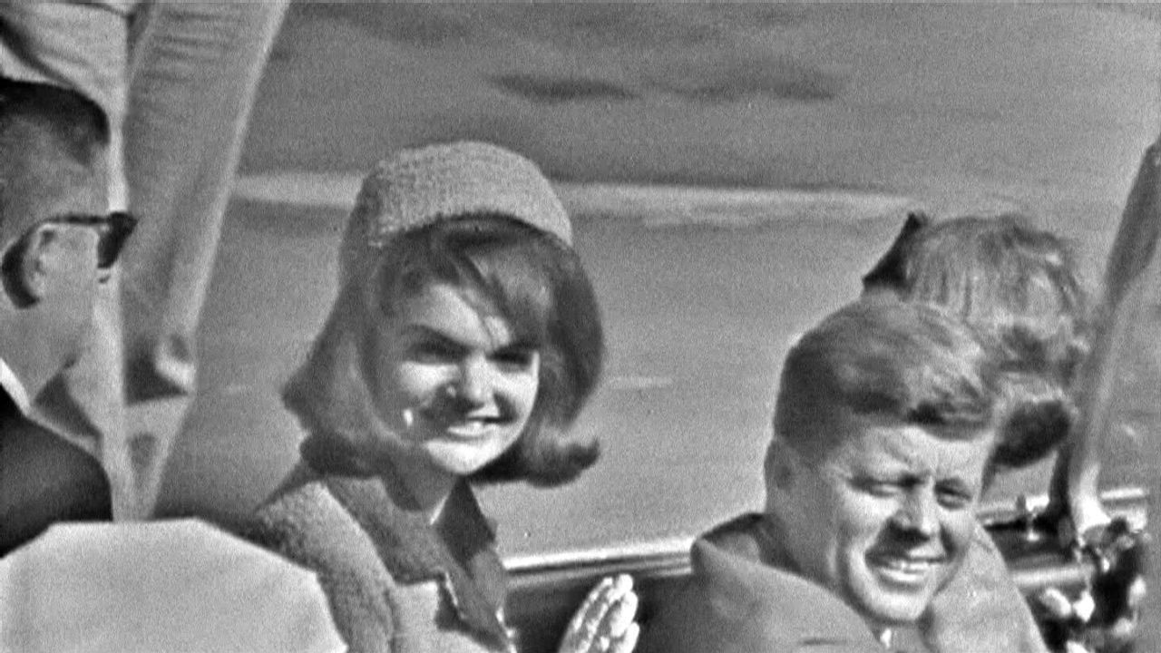 Jackie and John F. Kennedy ride in the Dallas motorcade on November 22, 1963.