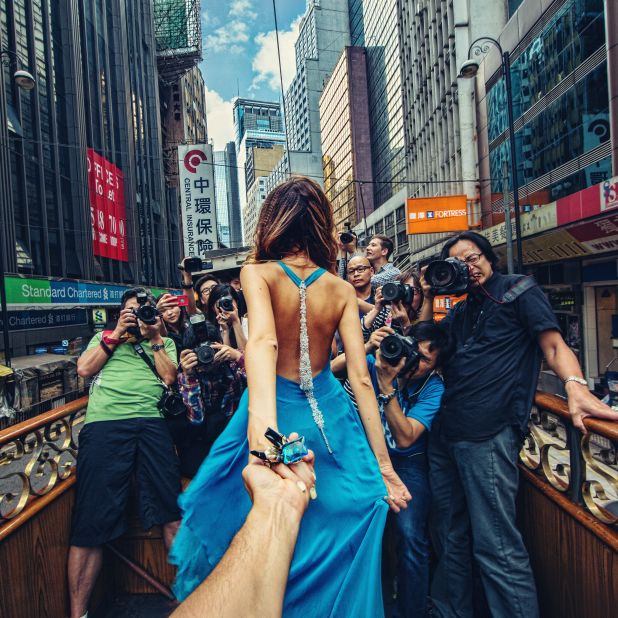 They'll roll out a series of images over the course of the next few weeks. Here they're snapped by Hong Kong journalists as they ride on an open-top bus. 