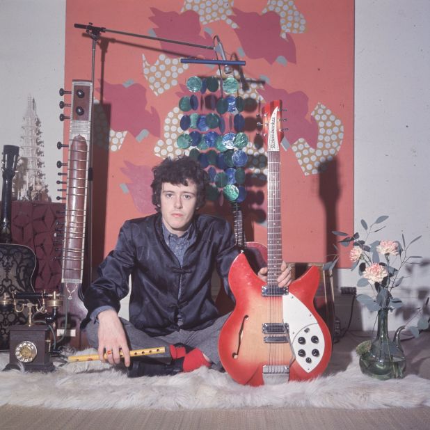 Donovan holds his Rickenbacker guitar. He sang a mixture of folk and blues with wistful lyrics that captured the mood of the love generation. He recorded "Catch the Wind" when he was just 18.